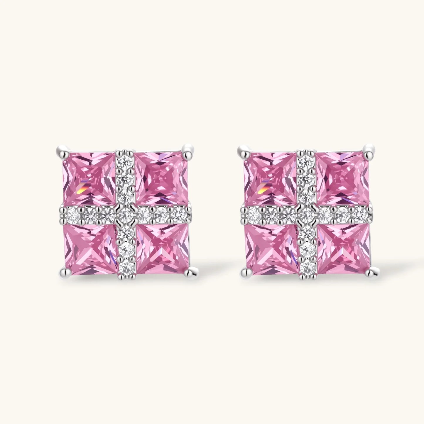 White gold plated jewelry set with pink cubic zirconia stones in geometric cross design, featuring Y-necklace and square stud earrings