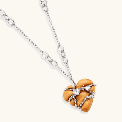 Adjustable brass chain necklace with natural wood heart pendant featuring wire wrapping and zirconia crystal accents