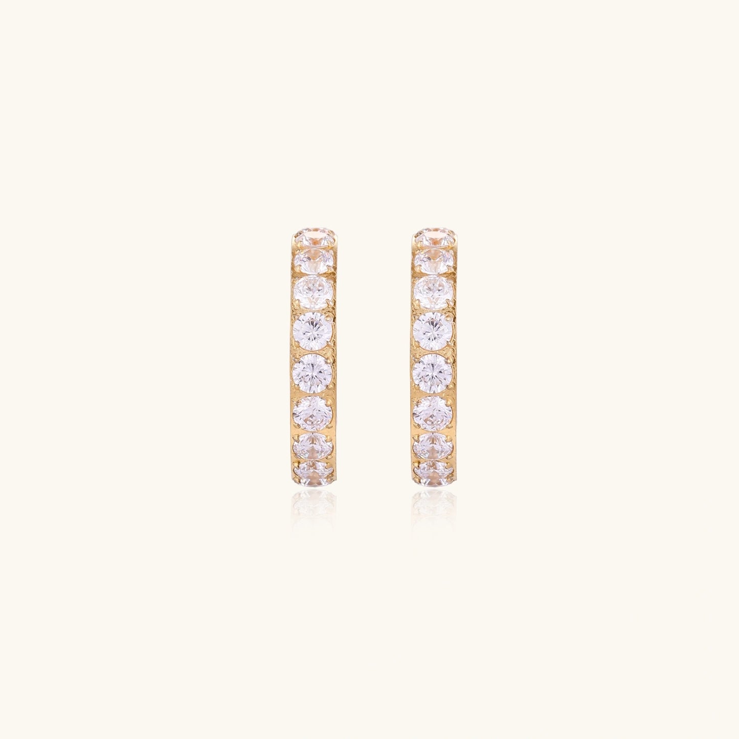 Gold pavé hoop earrings with two freshwater pearls nestled inside the curved design, featuring crystal-studded outer edge.