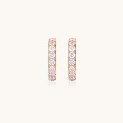 Gold pavé hoop earrings with two freshwater pearls nestled inside the curved design, featuring crystal-studded outer edge.